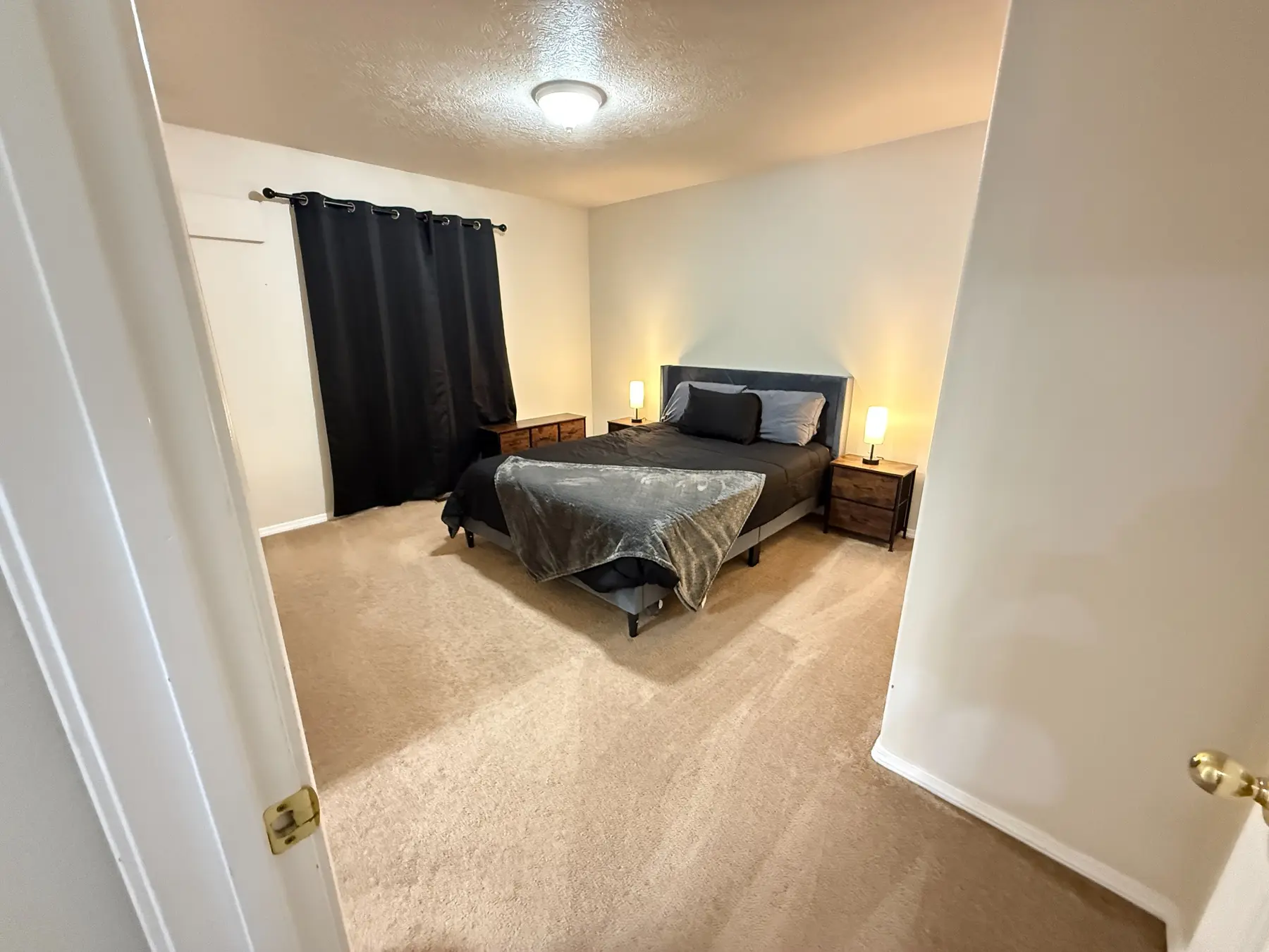 Primary queen bedroom at Dora Drive Bright Stay